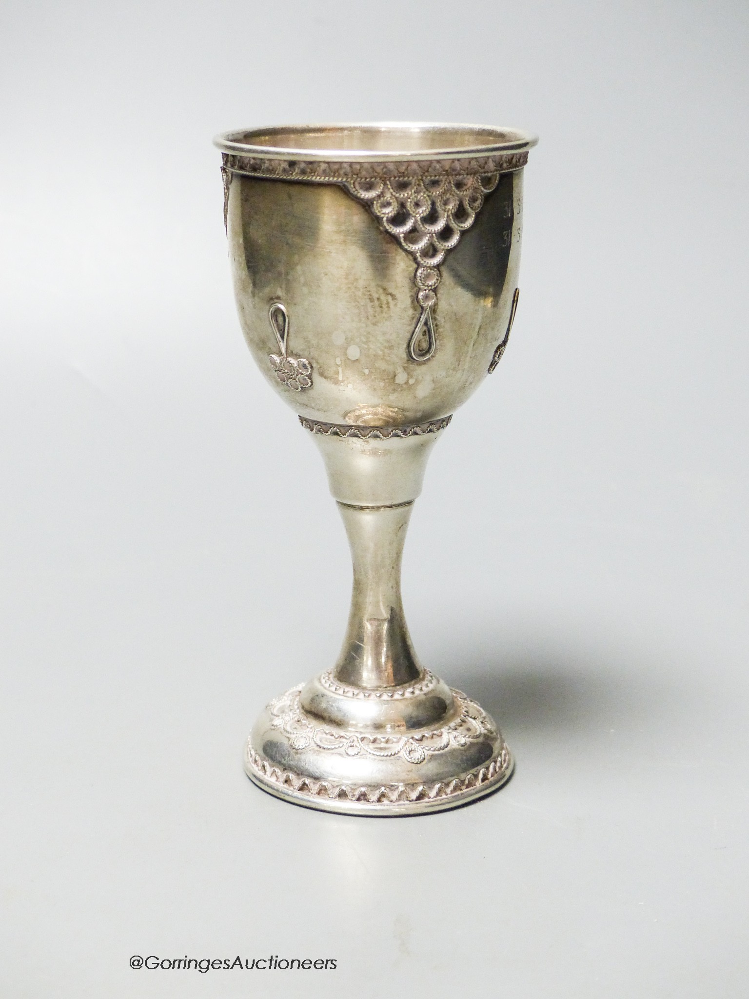 A modern silver goblet, with filigree decoration, London, 1980, 13.2cm, 73 grams.